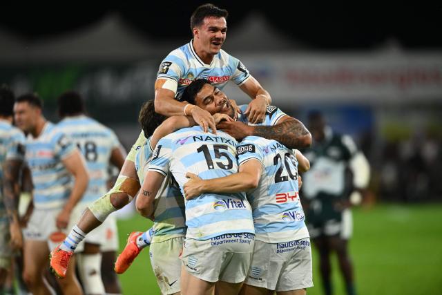 Racing 92' French full-back Max Spring (C) jumps to celebrate after winning the French Top14 rugby union playoff match between Section Paloise Bearn Pyrenees (Pau) and Racing 92 at Stade du Hameau in Pau, south-western France on June 13, 2026. (Photo by Gaizka IROZ / AFP)