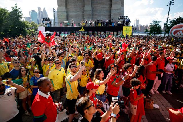 Brazil and Morocco fans attend a watch party for the 2026 World Cup football tournament match between Brazil and Morocco at the FIFA Fan Zone in Brooklyn, New York, on June 13, 2026. (Photo by Leonardo MUNOZ / AFP)