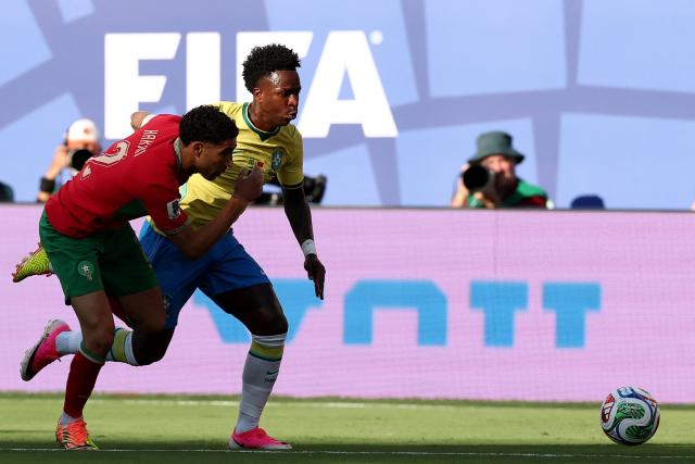 Morocco's defender #02 Achraf Hakimi (L) and Brazil's forward #07 Vinicius Junior (R) fight for the ball during the 2026 World Cup Group C football match between Brazil and Morocco at the New York/New Jersey Stadium in East Rutherford on June 13, 2026. (Photo by CHARLY TRIBALLEAU / AFP)