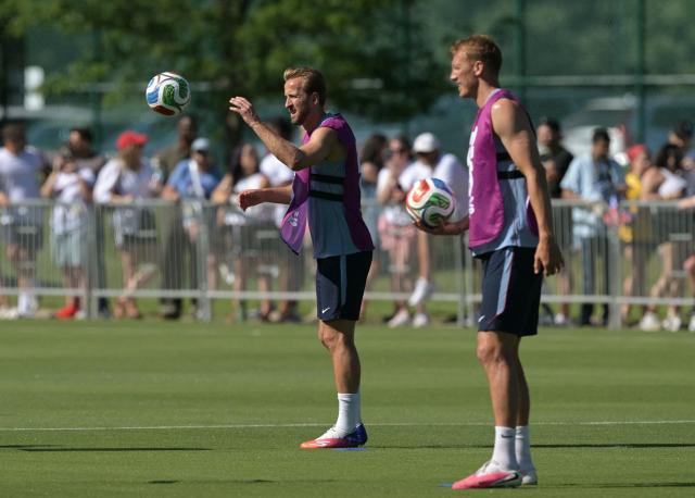 England's forward #09 Harry Kane and defender #15 Dan Burn attend a training session ahead of England's 2026 World Cup football tournament Group L football match against Croatia at Swope Soccer Village in Kansas City on June 13, 2026.  (Photo by JUAN MABROMATA / AFP)