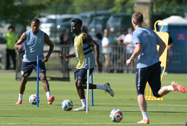 England's forward #07 Bukayo Saka plays with a ball during a training session ahead of England's 2026 World Cup football tournament Group L football match against Croatia at Swope Soccer Village in Kansas City on June 13, 2026.  (Photo by JUAN MABROMATA / AFP)