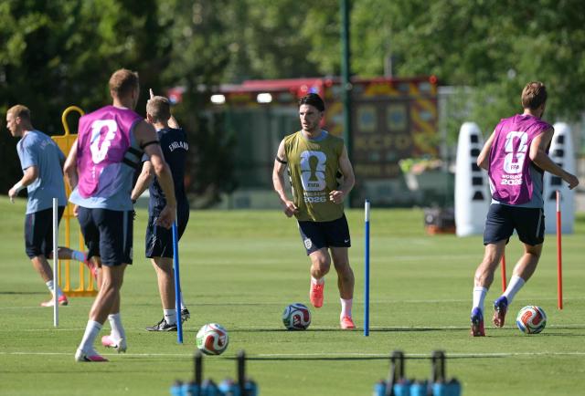 England's midfielder #04 Declan Rice plays with a ball during a training session ahead of England's 2026 World Cup football tournament Group L football match against Croatia at Swope Soccer Village in Kansas City on June 13, 2026.  (Photo by JUAN MABROMATA / AFP)