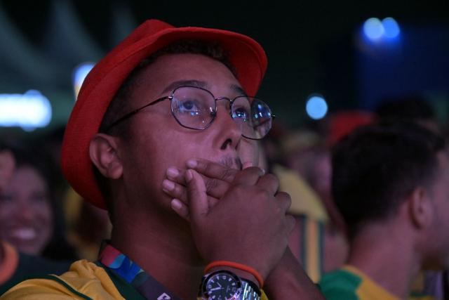 A Brazilian fan watches the live broadcast of the 2026 World Cup football match between Brazil and Morocco at the Copacabana Arena in Rio de Janeiro, Brazil, on June 13 2026. (Photo by NELSON ALMEIDA / AFP)
