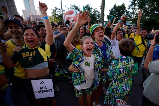 Brazil fans celebrate a goal of their team during a watch party during the 2026 World Cup football tournament match between Brazil and Morocco at the FIFA Fan Zone in Brooklyn, New York, on June 13, 2026. (Photo by Leonardo MUNOZ / AFP)