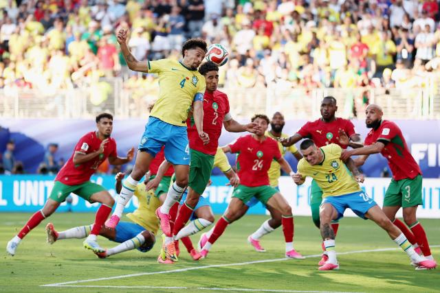 Brazil's defender #04 Marquinhos and Morocco's defender #02 Achraf Hakimi fight for the ball during the 2026 World Cup Group C football match between Brazil and Morocco at the New York/New Jersey Stadium in East Rutherford on June 13, 2026. (Photo by CHARLY TRIBALLEAU / AFP)