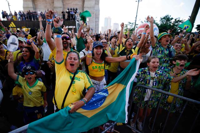 Brazil fans celebrate a goal of their team during a watch party during the 2026 World Cup football tournament match between Brazil and Morocco at the FIFA Fan Zone in Brooklyn, New York, on June 13, 2026. (Photo by Leonardo MUNOZ / AFP)