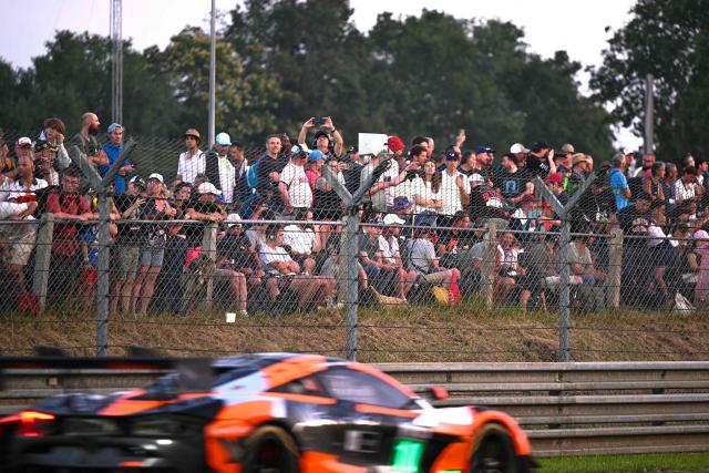 People look at the 94th edition of the 24 Hours of Le Mans, the motor endurance race, in Le Mans, western France, on June 13, 2026. (Photo by Lou BENOIST / AFP)