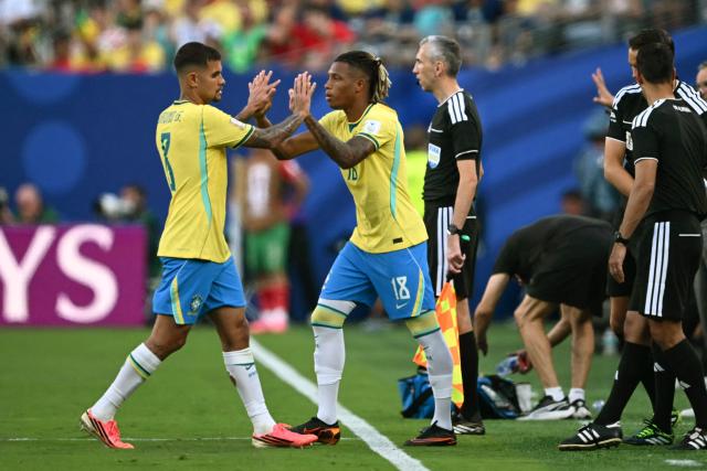 Brazil’s midfielder #08 Bruno Guimaraes (L) leaves the pitch after being substituted by Brazil’s midfielder #18 Danilo Santos during the 2026 World Cup Group C football match between Brazil and Morocco at the New York/New Jersey Stadium in East Rutherford on June 13, 2026. (Photo by Mauro PIMENTEL / AFP)