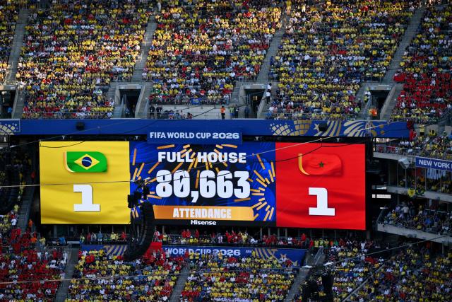 This view shows a big screen with the scores during during the 2026 World Cup Group C football match between Brazil and Morocco at the New York/New Jersey Stadium in East Rutherford on June 13, 2026. (Photo by Angela WEISS / AFP)