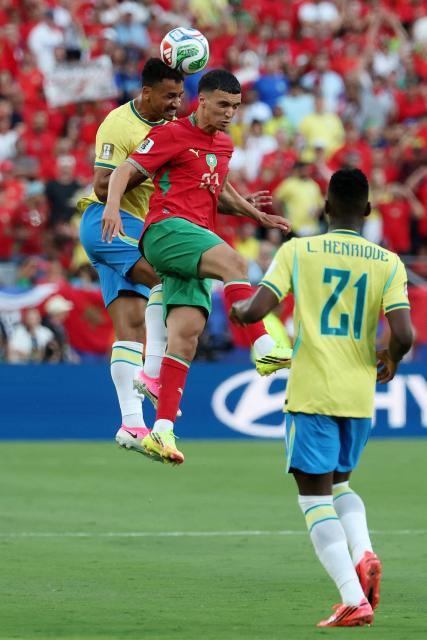 Brazil's defender #13 Danilo heads the ball past Morocco's midfielder #23 Bilal El Khannouss during the 2026 World Cup Group C football match between Brazil and Morocco at the New York/New Jersey Stadium in East Rutherford on June 13, 2026. (Photo by TIMOTHY A. CLARY / AFP)