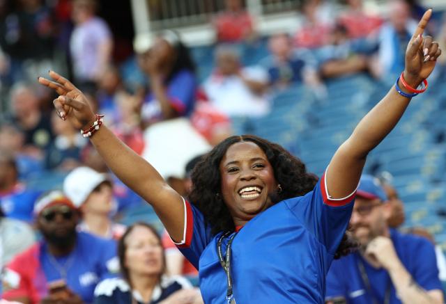 A Haiti fan poses for pictures ahead of the 2026 World Cup Group C football match between Haiti and Scotland at the Boston Stadium in Foxborough on June 13, 2026. (Photo by FRANCK FIFE / AFP)