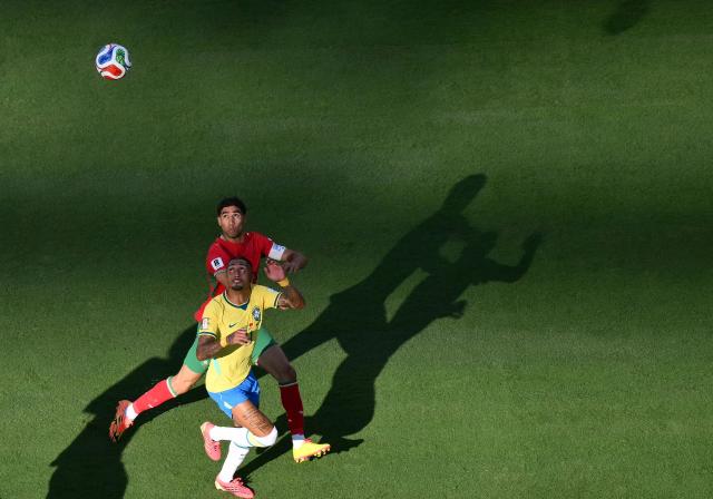 Brazil's forward #11 Raphinha and Morocco's defender #02 Achraf Hakimi eye the ball during the 2026 World Cup Group C football match between Brazil and Morocco at the New York/New Jersey Stadium in East Rutherford on June 13, 2026. (Photo by Angela WEISS / AFP)