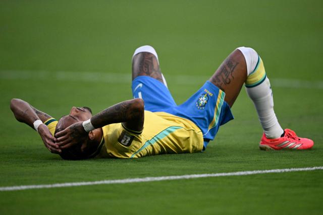 Brazil's forward #11 Raphinha reacts at the end of the 2026 World Cup Group C football match between Brazil and Morocco at the New York/New Jersey Stadium in East Rutherford on June 13, 2026. (Photo by Mauro PIMENTEL / AFP)