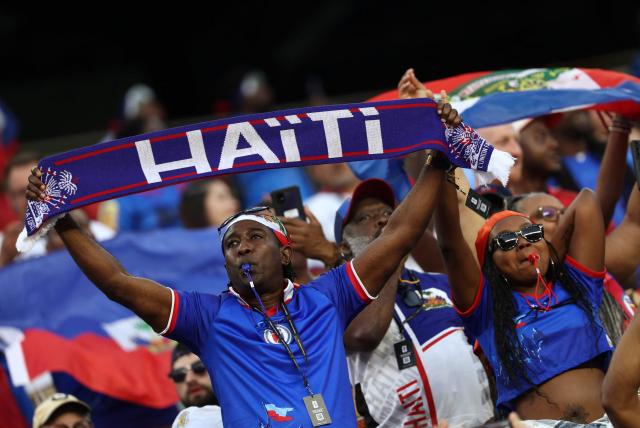 Haiti fans cheer ahead of the 2026 World Cup Group C football match between Haiti and Scotland at the Boston Stadium in Foxborough on June 13, 2026. (Photo by FRANCK FIFE / AFP)