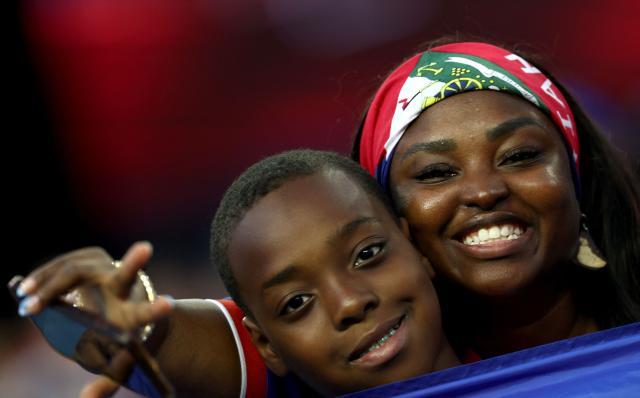 Haiti fans pose for pictures ahead of the 2026 World Cup Group C football match between Haiti and Scotland at the Boston Stadium in Foxborough on June 13, 2026. (Photo by FRANCK FIFE / AFP)