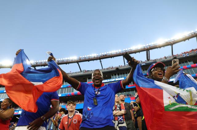 Haiti fans cheer ahead of the 2026 World Cup Group C football match between Haiti and Scotland at the Boston Stadium in Foxborough on June 13, 2026. (Photo by FRANCK FIFE / AFP)