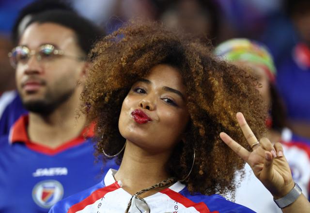 A Haiti fan poses for pictures ahead of the 2026 World Cup Group C football match between Haiti and Scotland at the Boston Stadium in Foxborough on June 13, 2026. (Photo by FRANCK FIFE / AFP)