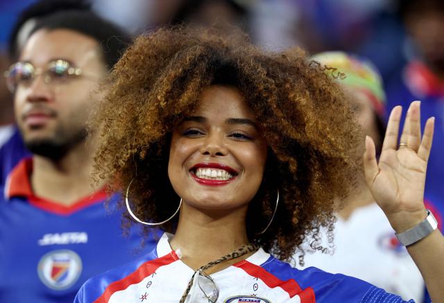 A Haiti fan poses for pictures ahead of the 2026 World Cup Group C football match between Haiti and Scotland at the Boston Stadium in Foxborough on June 13, 2026. (Photo by FRANCK FIFE / AFP)