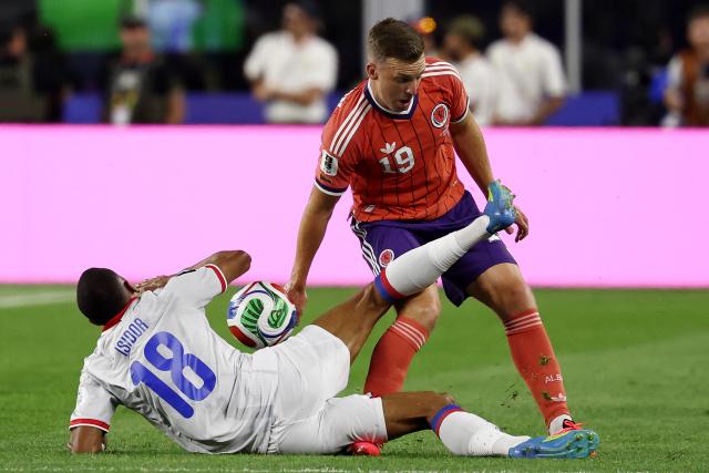 Haiti's forward #18 Wilson Isidor and Scotland's midfielder #19 Lewis Ferguson fight for the ball during the 2026 World Cup Group C football match between Haiti and Scotland at the Boston Stadium in Foxborough on June 13, 2026. (Photo by FRANCK FIFE / AFP)