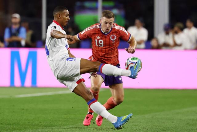 Haiti's forward #18 Wilson Isidor and Scotland's midfielder #19 Lewis Ferguson fight for the ball during the 2026 World Cup Group C football match between Haiti and Scotland at the Boston Stadium in Foxborough on June 13, 2026. (Photo by FRANCK FIFE / AFP)