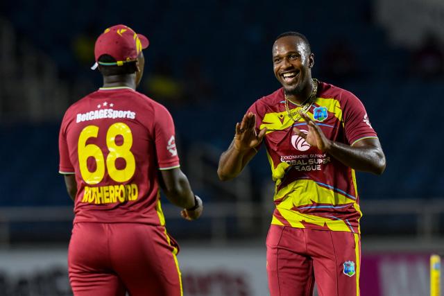 Matthew Forde (R) of West Indies celebrates the dismissal of Kamindu Mendis of Sri Lanka during the second Twenty20 (T20) international cricket match between West Indies and Sri Lanka at Sabina Park in Kingston, Jamaica, on June 13, 2026. (Photo by Randy Brooks / AFP)