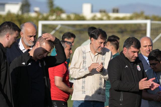 Iranian Football Federation President Mehdi Taj (2nd-L) and Mexican deputy Gerardo Fernandez Norona (C) attend the Iran's training session for the 2026 World Cup football tournament Group G football match against New Zealand in Tijuana, Mexico on June 13, 2026.  (Photo by Guillermo Arias / AFP)