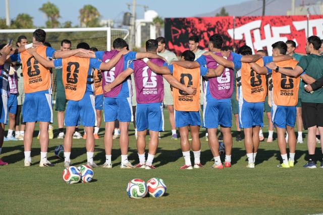 Iran's players gather in circle during a training session for the 2026 World Cup football tournament Group G football match against New Zealand in Tijuana, Mexico on June 13, 2026.  (Photo by Guillermo Arias / AFP)