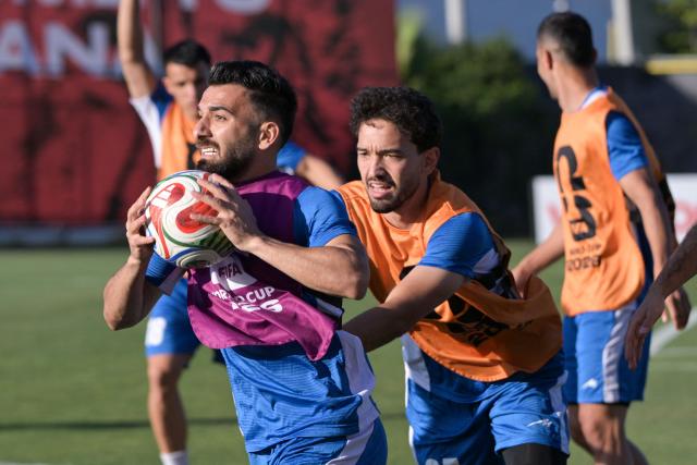 Iran's midfielder #26 Amirmohammad Razaghinia (L) and teammates take part in training session for the 2026 World Cup football tournament Group G football match against New Zealand in Tijuana, Mexico on June 13, 2026.  (Photo by Guillermo Arias / AFP)
