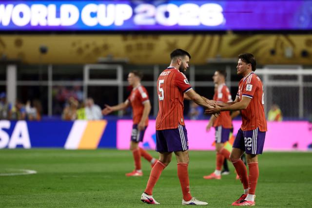 Scotland's defender #05 Grant Hanley and defender #22 Nathan Patterson react after winning the 2026 World Cup Group C football match between Haiti and Scotland at the Boston Stadium in Foxborough on June 13, 2026. (Photo by FRANCK FIFE / AFP)