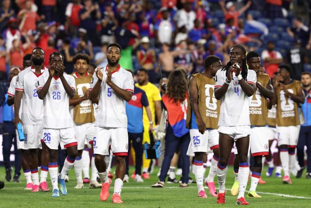 Haiti players acknowledge the crowd after losing the 2026 World Cup Group C football match between Haiti and Scotland at the Boston Stadium in Foxborough on June 13, 2026. (Photo by FRANCK FIFE / AFP)