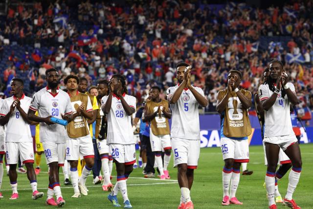 Haiti players acknowledge the crowd after losing the 2026 World Cup Group C football match between Haiti and Scotland at the Boston Stadium in Foxborough on June 13, 2026. (Photo by FRANCK FIFE / AFP)