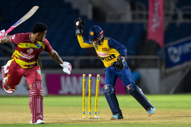 Shimron Hetmyer (L) of West Indies run out by Kusal Mendis (R) of Sri Lanka during the second Twenty20 (T20) international cricket match between West Indies and Sri Lanka at Sabina Park in Kingston, Jamaica, on June 13, 2026. (Photo by Randy Brooks / AFP)