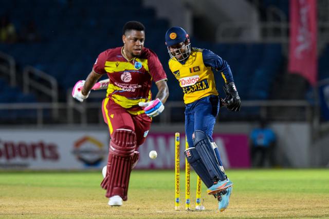 Shimron Hetmyer (L) of West Indies runs out by Kusal Mendis (R) of Sri Lanka during the second Twenty20 (T20) international cricket match between West Indies and Sri Lanka at Sabina Park in Kingston, Jamaica, on June 13, 2026. (Photo by Randy Brooks / AFP)