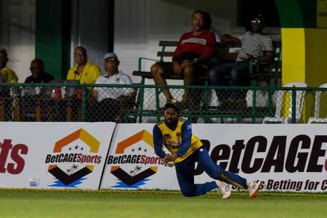 Kamindu Mendis of Sri Lanka takes the catch to dismiss Roston Chase of West Indies during the second Twenty20 (T20) international cricket match between West Indies and Sri Lanka at Sabina Park in Kingston, Jamaica, on June 13, 2026. (Photo by Randy Brooks / AFP)