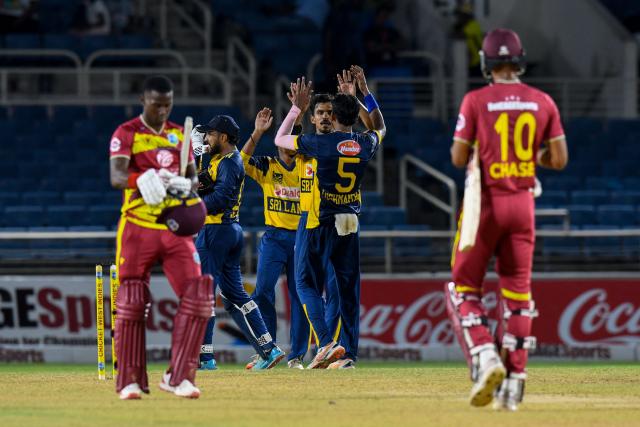 Sri Lanka players celebrate winning the second T20i match between West Indies and Sri Lanka at Sabina Park, Kingston, Jamaica, on June 13, 2026. (Photo by Randy Brooks / AFP)