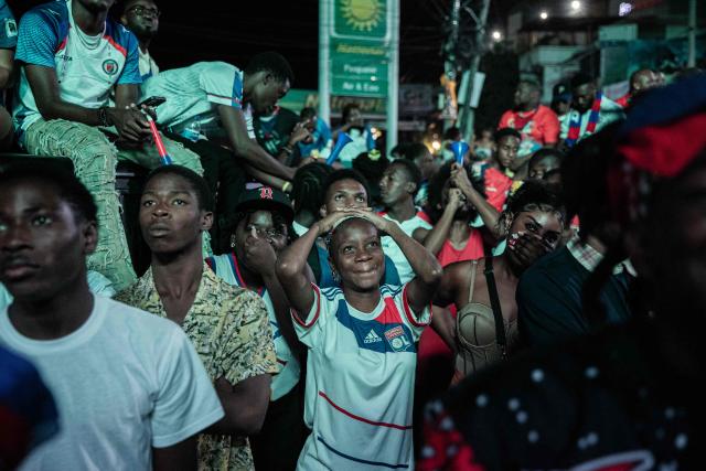 Haiti fans react while watching the 2026 FIFA World Cup match between Haiti and Scotland, in Petion-ville, Port-au-Prince, Haiti, on June 13, 2026. (Photo by Clarens SIFFROY / AFP)