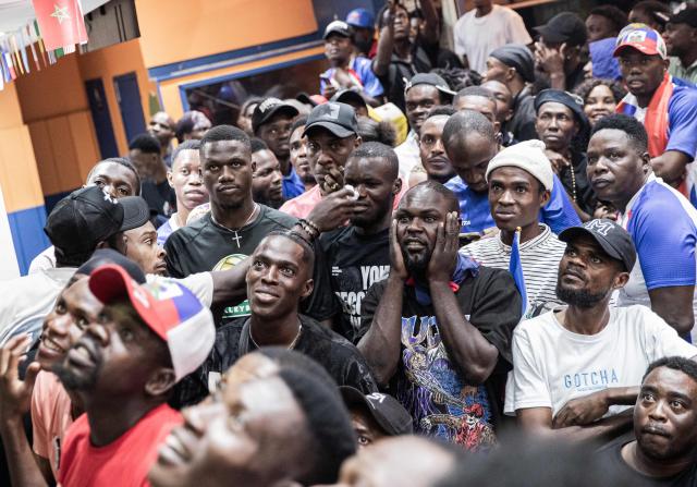 Haiti fans react while watching the 2026 FIFA World Cup match between Haiti and Scotland, in Petion-ville, Port-au-Prince, Haiti, on June 13, 2026. (Photo by Clarens SIFFROY / AFP)