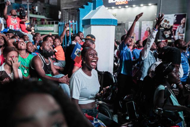Haiti fans react while watching the 2026 FIFA World Cup match between Haiti and Scotland, in Petion-ville, Port-au-Prince, Haiti, on June 13, 2026. (Photo by Clarens SIFFROY / AFP)