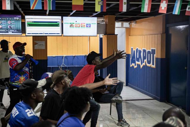 Haiti fans react while watching the 2026 FIFA World Cup match between Haiti and Scotland, in Petion-ville, Port-au-Prince, Haiti, on June 13, 2026. (Photo by Clarens SIFFROY / AFP)