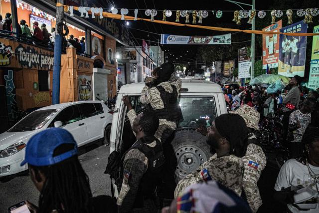 Police officers watch the 2026 FIFA World Cup match between Haiti and Scotland, in Petion-ville, Port-au-Prince, Haiti, on June 13, 2026. (Photo by Clarens SIFFROY / AFP)