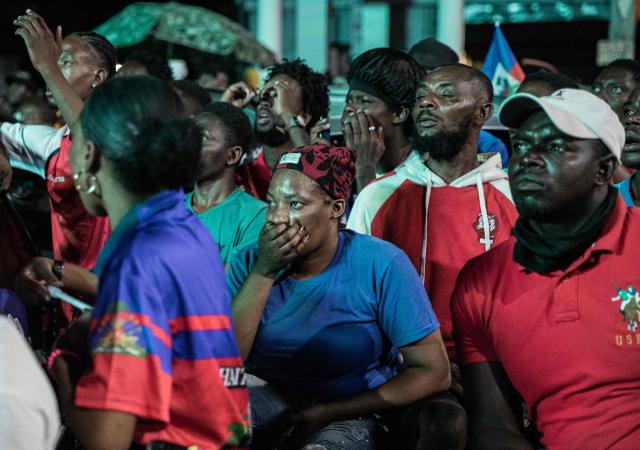 Haiti fans react while watching the 2026 FIFA World Cup match between Haiti and Scotland, in Petion-ville, Port-au-Prince, Haiti, on June 13, 2026. (Photo by Clarens SIFFROY / AFP)