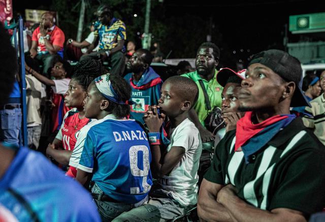 Haiti fans watch the 2026 FIFA World Cup match between Haiti and Scotland, in Petion-ville, Port-au-Prince, Haiti, on June 13, 2026. (Photo by Clarens SIFFROY / AFP)