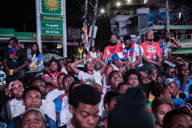 Haiti fans react while watching the 2026 FIFA World Cup match between Haiti and Scotland, in Petion-ville, Port-au-Prince, Haiti, on June 13, 2026. (Photo by Clarens SIFFROY / AFP)