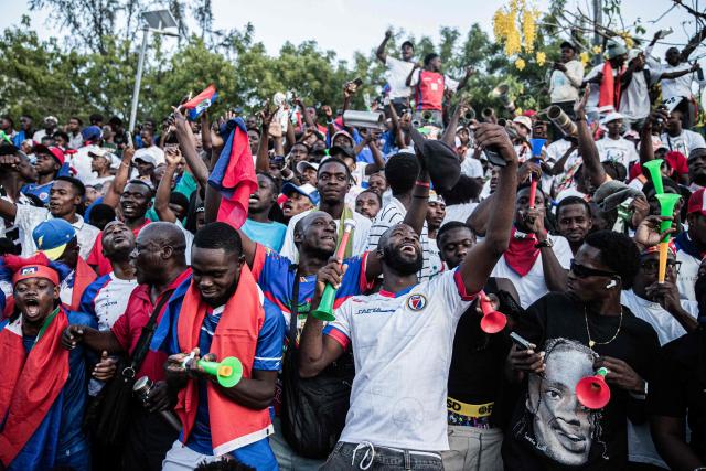 Fans of Haiti react during the 2026 FIFA World Cup match between Haiti and Scotland, in Port-Au-Prince, on June 13, 2026. (Photo by Clarens SIFFROY / AFP)