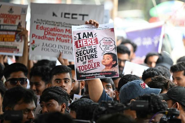 Cockroach Janata Party (CJP) activists hold placards during a protest over alleged irregularities in India’s major examinations in Hyderabad on June 14, 2026. (Photo by Noah SEELAM / AFP)