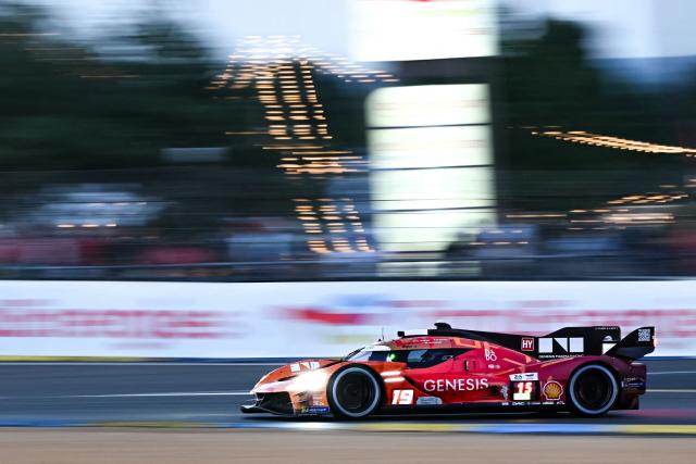 German BMW M Hybrid V8 Hypercar #15 of BMW M TEAM WRT (LMDh) competes during the 94th edition of the 24 Hours of Le Mans, the motor endurance race, in Le Mans, western France, on June 14, 2026. (Photo by Lou BENOIST / AFP)