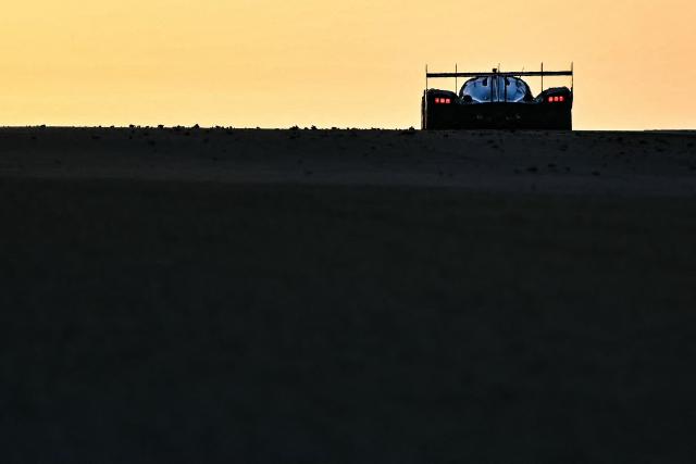 A car competes during the 94th edition of the 24 Hours of Le Mans, the motor endurance race, in Le Mans, western France, on June 14, 2026. (Photo by Lou BENOIST / AFP)