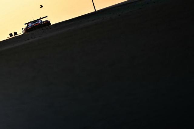 A car competes during the 94th edition of the 24 Hours of Le Mans, the motor endurance race, in Le Mans, western France, on June 14, 2026. (Photo by Lou BENOIST / AFP)