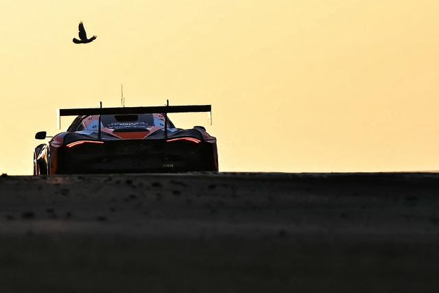 A car competes during the 94th edition of the 24 Hours of Le Mans, the motor endurance race, in Le Mans, western France, on June 14, 2026. (Photo by Lou BENOIST / AFP)