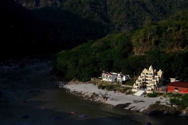 Tourists raft down the river Ganges in Rishikesh on June 13, 2026. (Photo by Manan VATSYAYANA / AFP)